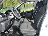 the interior of a white van with black leather seats and a steering wheel