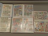 many different types of stamps on the pages of a book
