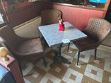 two chairs and a table in the corner of a room