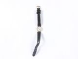an image of a watch on a white surface with a black strap