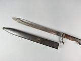 a knife and a knife holder on a white surface