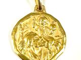 an image of a gold coin with the image of jesus on it