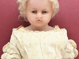 a small doll that is sitting on a table