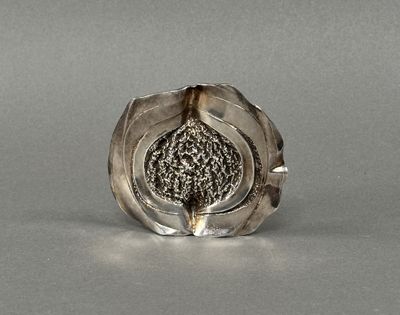 a silver ring with a black stone inside of it
