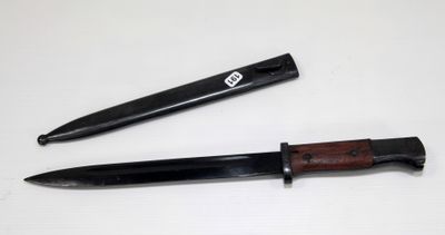 a knife and a pen sitting on a table