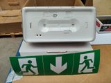 a white box with a green and white sign and a white box with a green and white sign and a white box with a green and white sign