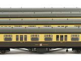 a yellow and black train car sitting on a white surface
