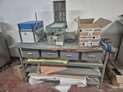 a workbench with a bunch of boxes on top of it