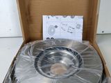 an open box with a disc in it sitting on a table
