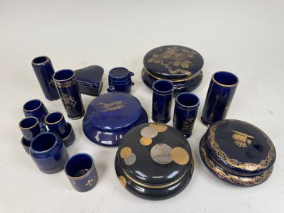 a lot of blue vases and cups sitting on a table