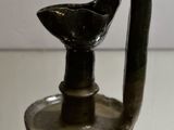 a small glass vase with a bird on it