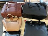 many bags that are sitting on a table