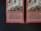 two cards that are sitting on a table