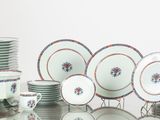 a lot of plates and cups on the table