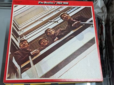 une image d'un album des Beatles avec la pochette de cet album