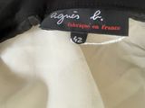 the label on a black and white jacket is attached to a white shirt