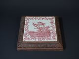 an old wooden box with a pink and white design on it