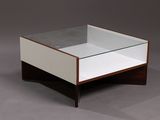 an image of a coffee table with a glass top and wooden legs