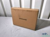 the box is sitting on the table next to the chair