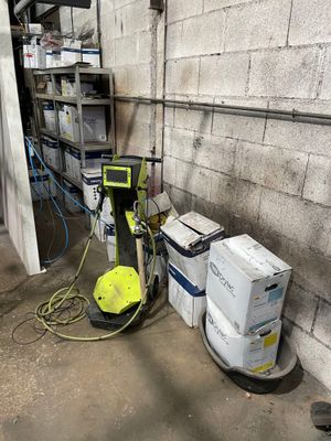 a machine that is sitting next to a pile of boxes