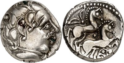 a silver coin with an image of a horse and rider on it