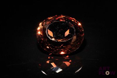 an image of an orange diamond on a black surface