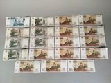 several different types of currency are displayed on a table