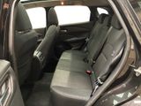 the back seats of a car are empty and the passenger seat is empty