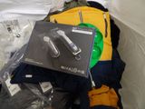 a box of items that are sitting on a bed