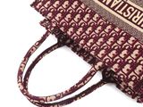 a close up of a purse with a wrist strap