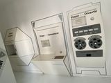 three machines that are on display in a room