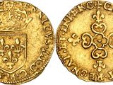 a gold coin with a crown on the front and a shield on the back