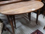 a table and chairs in a room with a rug on the floor