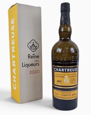 the bottle of wine is next to a box of wine