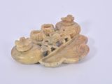 a small figurine of a boat with flowers on it