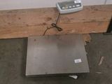 an image of a scale sitting on the floor in a room