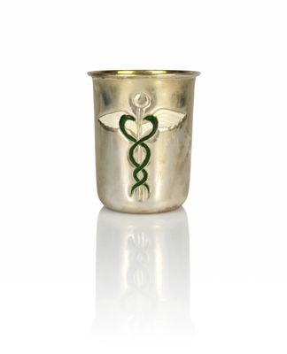 an image of a gold cup with a green snake on it