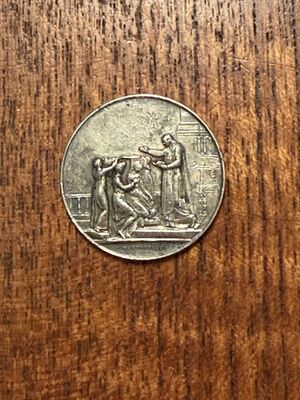 a coin that is sitting on a wooden table