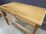 a wooden table with a drawer on top of it