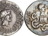 a silver coin with an image of a woman on it