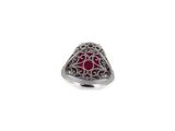 silver ring with red stone and filigree design