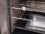 an open oven with some food inside of it