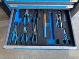 many tools in a tool box on the floor