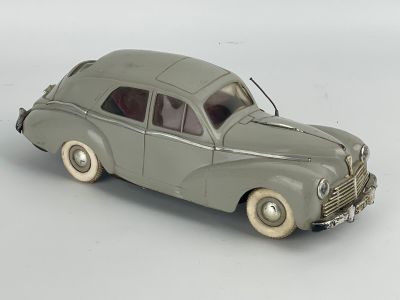 a toy car that is sitting on a white surface