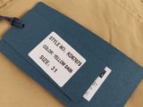 the back of a pair of khaki pants with a tag on it