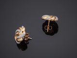 a pair of gold and diamond earrings