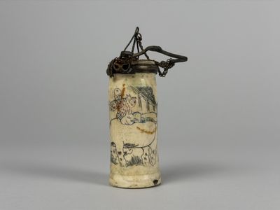 a small vase that has a drawing on it
