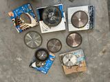 many different types of circular saw blades on the floor