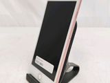 a cell phone that is sitting on a stand