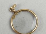 a close up of a magnifying glass on a white surface